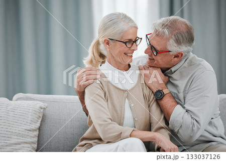 Love, hug and mockup with a senior couple sitting on a sofa in the living room of their home together. Romance, affection or mock up with a mature man and woman hugging or bonding in their house Love, hug and mockup with a senior couple sitting on a sofa in the living room of their home together. Romance, affection or mock up with a mature man and woman hugging or bonding in their house 133037126