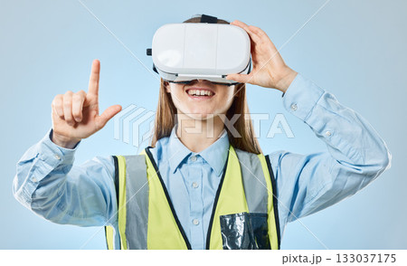 Employee, virtual reality glasses and pointing with woman, development and online planning against a blue studio background. Vr, female technician and engineer with metaverse, networking and success 133037175