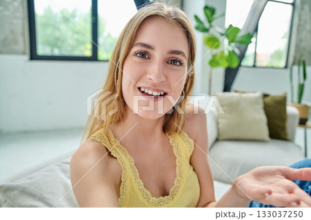 Close-up selfie portrait of teenage female looking at web camera Close-up selfie portrait of teenage female looking at web camera 133037250