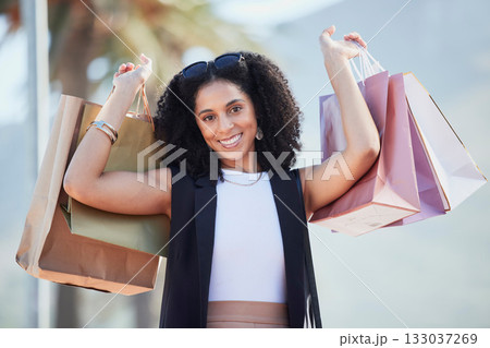Shopping, portrait and black woman with bags at a mall, happy and excited for sale. Face, fashion and girl with relax with luxury, purchase while walking outdoors, satisfied and cheerful on weekend Shopping, portrait and black woman with bags at a mall, happy and excited for sale. Face, fashion and girl with relax with luxury, purchase while walking outdoors, satisfied and cheerful on weekend 133037269