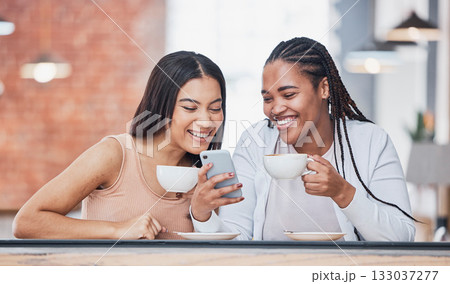 Women friends, coffee shop and smartphone with meme, happy and laugh at comic smile for social network. Gen z black woman, phone and relax in cafe with blog, funny video or reading on app for chat 133037277