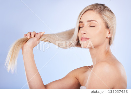 Hair care, face and beauty of woman with eyes closed in studio isolated on a background. Cosmetics, keratin and young female model with salon treatment for long hairstyle, blonde balayage and growth. Hair care, face and beauty of woman with eyes closed in studio isolated on a background. Cosmetics, keratin and young female model with salon treatment for long hairstyle, blonde balayage and growth. 133037428