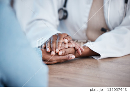 Holding hands closeup, doctor and patient consultation for healthcare support, services and sad news, test results or help. Clinic, medical professional or black people consulting, helping and advice 133037448