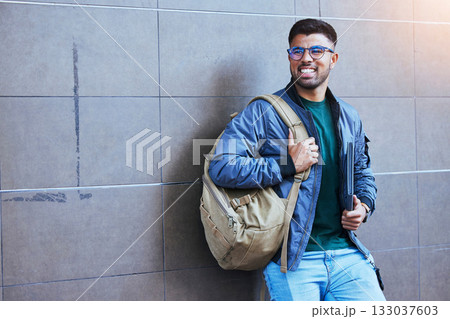 Happy, laughing and man on a wall for education, studying and university in the city. Smile, looking and student ready to start college on a campus for learning, scholarship and excited about school Happy, laughing and man on a wall for education, studying and university in the city. Smile, looking and student ready to start college on a campus for learning, scholarship and excited about school 133037603