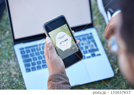 Hands, phone and laptop mockup screen for discount, sale or advertising announcement and news outdoors. Hand of man on smartphone app with display by computer for special marketing deal in nature 133037657