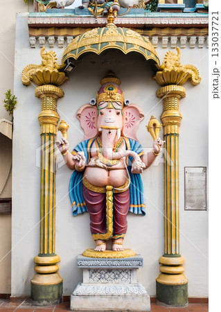 Colorful ganesha statue in penang street adorned with intricate details and surrounded by urban structure 133037721