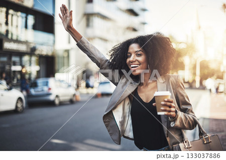 Woman, travel and hands in city for taxi, lift or street transportation with coffee outdoors. Happy female person waving hand and waiting for transport, ride or pickup on road sidewalk in urban town Woman, travel and hands in city for taxi, lift or street transportation with coffee outdoors. Happy female person waving hand and waiting for transport, ride or pickup on road sidewalk in urban town 133037886