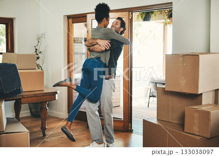 Happy couple, hug and real estate moving in new home for relocation, renovation or investment together. Interracial man hugging woman and homeowners with boxes in house for move, mortgage or property Happy couple, hug and real estate moving in new home for relocation, renovation or investment together. Interracial man hugging woman and homeowners with boxes in house for move, mortgage or property 133038097