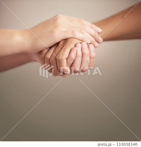 Empathy, support and help with people holding hands in comfort, care or to console each other. Trust, love or healing with friends praying together during depression, anxiety or the pain of loss 133038140