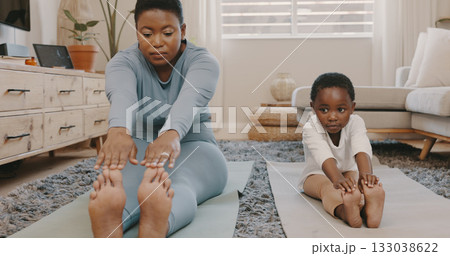 Black family, yoga and a mother with her daughter in the home together for fitness, wellness or balance. Kids, exercise or stretching with a woman parent and girl child in the living room for health 133038622