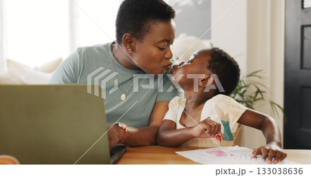 Kiss, laptop or remote work and a black woman with her daughter in the living room for business or education. Family, love or distance learning with a parent and her girl child working at a table 133038636