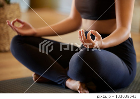Hands, lotus pose and woman on a floor for yoga, mediation and zen in her living room. Hand, girl and meditation for fitness, peace and balance, chakra and energy training, spiritual and healing 133038643