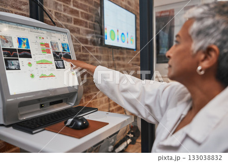 Woman optometrist, retina and medical computer for eye analysis, research or lens test in lab. Optician, technology and doctor monitor screen in consultation, vision service and ophthalmology anatomy 133038832