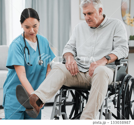 Wheelchair help, nursing home and man with injury or disability with nurse support. Wellness, healthcare and retirement of a elderly person with foot pain from a medical problem with caregiver 133038987