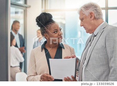 Documents, discussion and man and black woman talking in office for business proposal, strategy or advice. Collaboration, teamwork and corporate managers meeting for project, report or finance review Documents, discussion and man and black woman talking in office for business proposal, strategy or advice. Collaboration, teamwork and corporate managers meeting for project, report or finance review 133039026