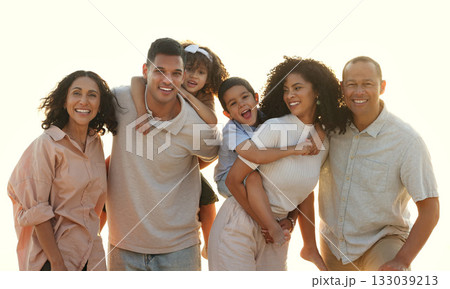 Sunset, big family and portrait smile at beach, having fun and smiling on vacation outdoors. Care, bonding and happy kids, grandmother and grandfather with parents laughing and enjoying holiday time. 133039213