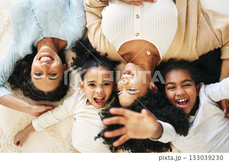 Bed, top view and grandma, mother and children smile for bonding, quality time and love in bedroom. Big family, happy and portrait of grandmother, mom and girls in bedroom relaxing together at home Bed, top view and grandma, mother and children smile for bonding, quality time and love in bedroom. Big family, happy and portrait of grandmother, mom and girls in bedroom relaxing together at home 133039230