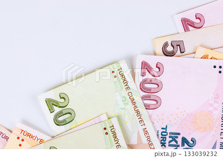 Currency denominations of Turkish lira laid out on light background showcasing various banknotes Currency denominations of Turkish lira laid out on light background showcasing various banknotes 133039232