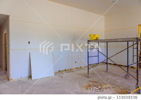 Room under construction with drywall scaffolding at residential building site Room under construction with drywall scaffolding at residential building site 133039336