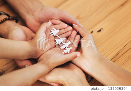 Insurance, cutout and paper with hands of family for protection, security and planning. Future, care and compassion with parents and child holding figure icon together for wellbeing, trust and hope Insurance, cutout and paper with hands of family for protection, security and planning. Future, care and compassion with parents and child holding figure icon together for wellbeing, trust and hope 133039394