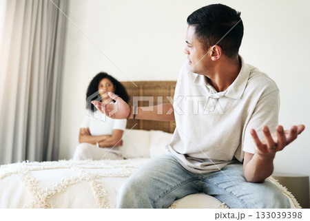 Argument, stress and couple in bedroom for conflict, breakup conversation and communication. Sad, angry and man speaking to a woman about relationship, divorce and frustrated with problem in marriage Argument, stress and couple in bedroom for conflict, breakup conversation and communication. Sad, angry and man speaking to a woman about relationship, divorce and frustrated with problem in marriage 133039398