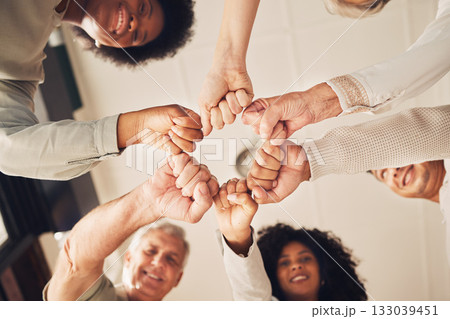 Portrait, hands fist bump and business people happy for diversity, company solidarity or collaboration. Corporate group, mission teamwork and below view of design team building for community support 133039451