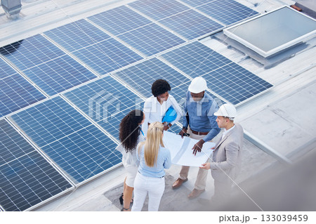 Solar energy, teamwork or engineering designers with blueprint on roof building grid technology for innovation. Collaboration, top view or business people talking or planning a development project 133039459