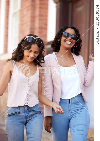 Shopping, city and happy friends or women walking together for retail discount, sale and promotion with gen z lifestyle. Young diversity people walk in urban street for fashion, wealth and clothes Shopping, city and happy friends or women walking together for retail discount, sale and promotion with gen z lifestyle. Young diversity people walk in urban street for fashion, wealth and clothes 133039574