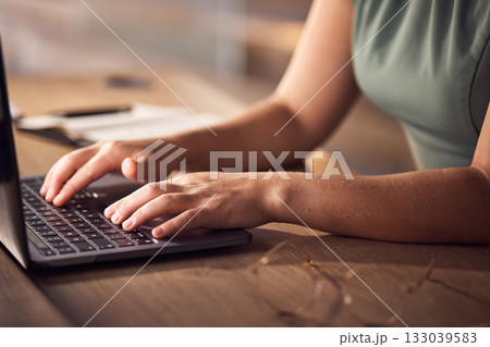 Business woman, hands or laptop typing in night office for company budget, investment management or finance data analytics. Zoom, worker or late employee on technology keyboard for financial report Business woman, hands or laptop typing in night office for company budget, investment management or finance data analytics. Zoom, worker or late employee on technology keyboard for financial report 133039583