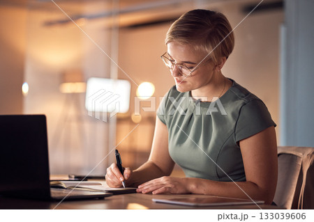 Serious woman, notebook or writing in night office for company planning, business schedule or ideas management. Corporate, worker or employee with book, pen or technology for evening project agenda Serious woman, notebook or writing in night office for company planning, business schedule or ideas management. Corporate, worker or employee with book, pen or technology for evening project agenda 133039606