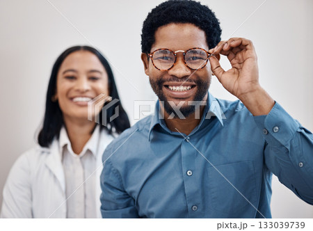 Optometry, glasses and portrait of black man and doctor for retail, choice and vision. Shopping, healthcare and medical with patient and woman for decision, frames or eye care in ophthalmology clinic Optometry, glasses and portrait of black man and doctor for retail, choice and vision. Shopping, healthcare and medical with patient and woman for decision, frames or eye care in ophthalmology clinic 133039739
