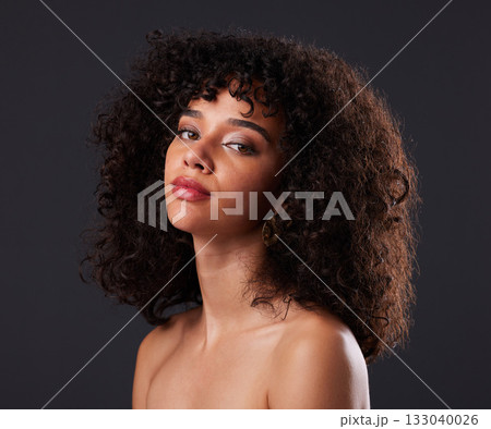 Portrait, makeup and beauty by black woman in studio for glamour, treatment and body care on black background. Face, girl and curly afro model relax with luxury, soft and glowing skin while isolated 133040026