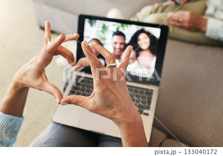 Hand heart, video call and love with laptop, family and communication with emoji, connection and bonding. Hands, person relax at home and happiness with care, connectivity with virtual chat in lounge Hand heart, video call and love with laptop, family and communication with emoji, connection and bonding. Hands, person relax at home and happiness with care, connectivity with virtual chat in lounge 133040172