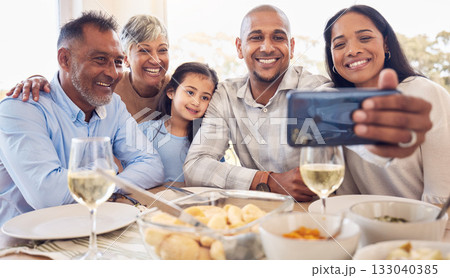 Black family selfie, lunch and smile in home with men, women and girl at table for celebration on web app. Man, smartphone photography and profile picture for social media with kid, parents and woman 133040385