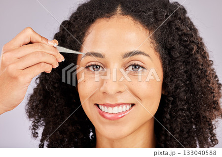 Eyebrow grooming, face tweezer and portrait of black woman with dermatology and facial hair cleaning. Skincare, epilation and clean beauty routine of a young model in a studio doing skin pore removal Eyebrow grooming, face tweezer and portrait of black woman with dermatology and facial hair cleaning. Skincare, epilation and clean beauty routine of a young model in a studio doing skin pore removal 133040588