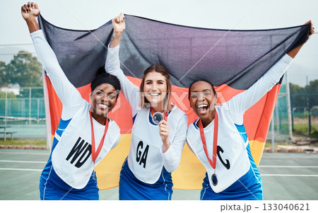 Sport winner, flag or netball team celebration, excited or celebrate winning award, competition victory or game success. Germany people, teamwork achievement or portrait athlete happy for prize medal 133040621