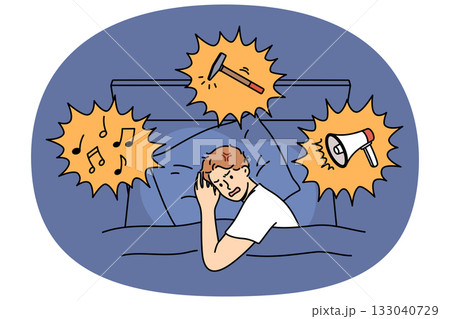 Noisy neighbors disturb sleep of irritated man lying in bed at night and in need of sleeping pills 133040729