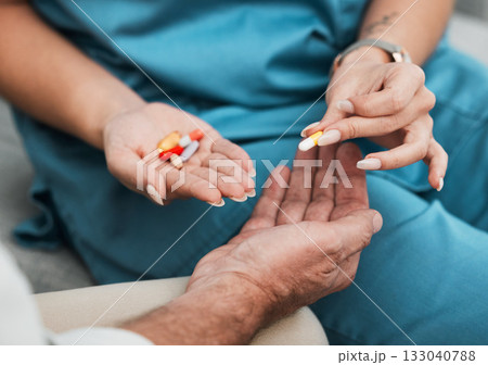 Pills, senior medication and man hands with a nurse and caregiver giving medicine at clinic. Retirement, nursing home and care of a healthcare, wellness and hospital worker with prescription drugs Pills, senior medication and man hands with a nurse and caregiver giving medicine at clinic. Retirement, nursing home and care of a healthcare, wellness and hospital worker with prescription drugs 133040788
