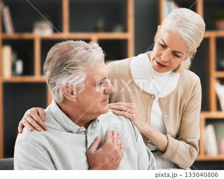 Heart attack, woman stress and senior couple at home with cardiology problem or stroke. House, marriage and retirement of a man with emergency and health issue in a living room with female support Heart attack, woman stress and senior couple at home with cardiology problem or stroke. House, marriage and retirement of a man with emergency and health issue in a living room with female support 133040806