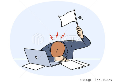Stressed business man waving white flag after professional burnout, lying at workplace with laptop 133040825