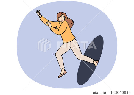 Happy woman jumps out of hole, showing readiness to move forward and energetic mood 133040839