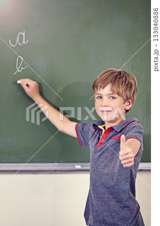 Portrait, child writing and thumbs up on blackboard in classroom, elementary school and mockup. Chalkboard, education student and kid with hand gesture for like emoji, agreement and learning to write Portrait, child writing and thumbs up on blackboard in classroom, elementary school and mockup. Chalkboard, education student and kid with hand gesture for like emoji, agreement and learning to write 133040886