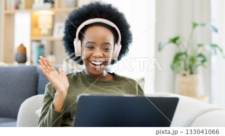 Woman, wave and headphones for video call on laptop with smile, people and job for work from home. African person, happy and excited for teleconference with friends, students or colleagues on web 133041066
