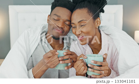 Coffee, bed and couple relax in morning in their home bedroom together. Drink, tea and love of black man and woman with care, comfort and support in healthy and happy marriage on vacation at a house Coffee, bed and couple relax in morning in their home bedroom together. Drink, tea and love of black man and woman with care, comfort and support in healthy and happy marriage on vacation at a house 133041101