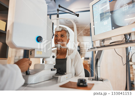 Machine, senior woman and test eyes in office, optometry and healthcare for vision, smile and conversation. Optometrist, mature female customer and client with eye care, research and appointment 133041153