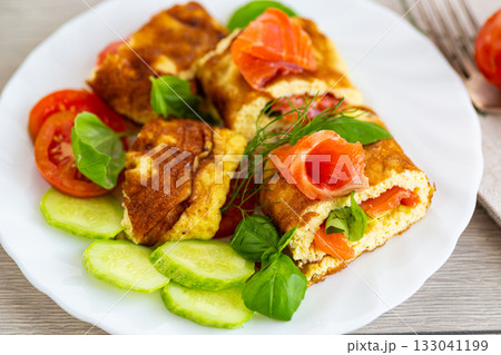 Homemade omelet with red fish and fresh spinach 133041199
