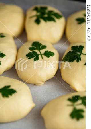 Soft dough preparation for homemade bread with fresh parsley Soft dough preparation for homemade bread with fresh parsley 133041237