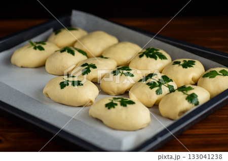 Soft dough preparation for homemade bread with fresh parsley 133041238