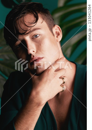 Gen z, model portrait and face of non binary person with designer fashion and green background. Isolated, studio and modern hipster clothes of an lgbtq and serious adult with youth and cool style Gen z, model portrait and face of non binary person with designer fashion and green background. Isolated, studio and modern hipster clothes of an lgbtq and serious adult with youth and cool style 133041264