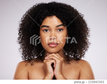Beauty, skincare and portrait of a serious black woman with cosmetics isolated on a grey studio background. Makeup, young and face of a model with a fresh afro, cosmetology and elegant on a backdrop Beauty, skincare and portrait of a serious black woman with cosmetics isolated on a grey studio background. Makeup, young and face of a model with a fresh afro, cosmetology and elegant on a backdrop 133041501